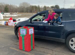 Kids dropping off letters to Santa.
