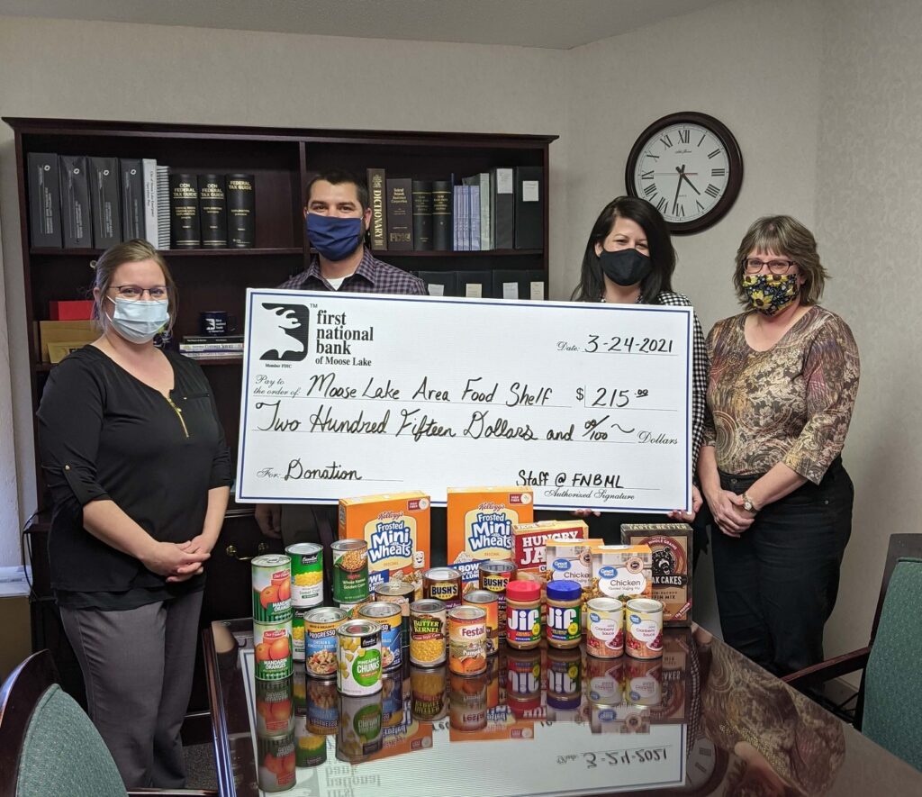 Kelly, Dan, Danielle, and Kristen are at the Main Bank with part of the donation to the Moose Lake Food Shelf